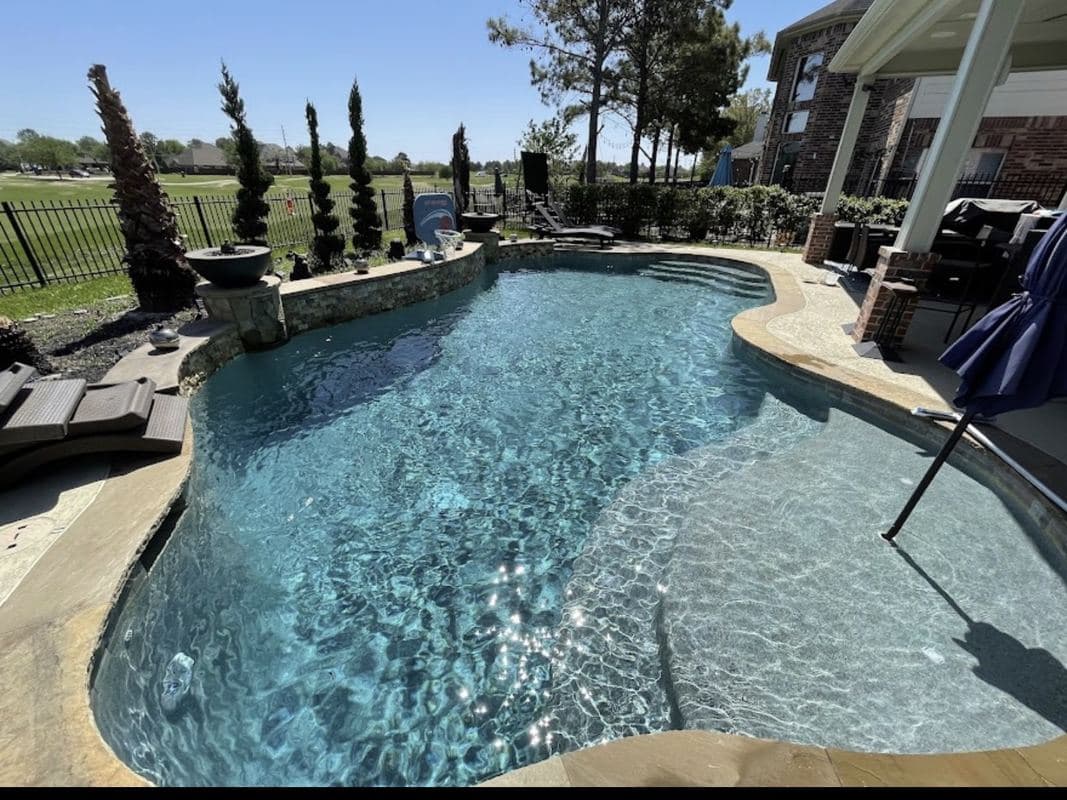 Luxury backyard pool renovated by Radiant Pools of Texas in Houston, TX
